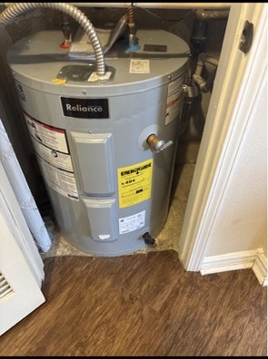Residential water heater with the temperature and pressure relief valve discharging directly into the room, with no drain pipe fitted.